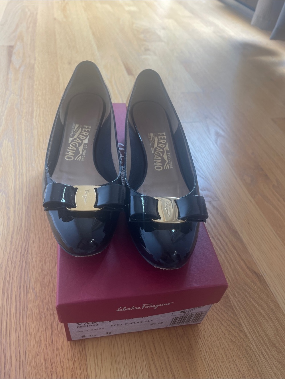 Salvatore Ferragamo Black Patent Vara Bow Flats with Gold Plaque